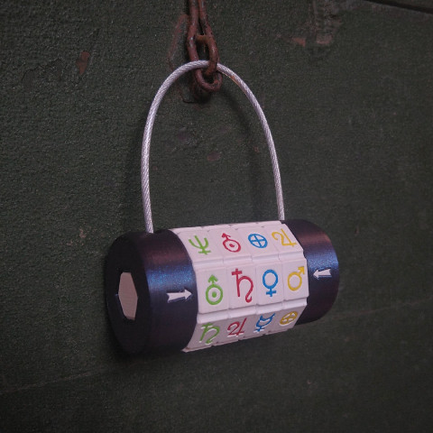 A custom-made padlock with multicoloured astrology symbols.