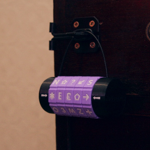 A custom-made padlock with purple dials and miscellaneous symbols.